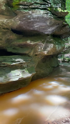 video clip of multicolored reflections on a rock in the gorge at Riffle Falls in Cottageville, WV